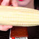 hand holding sweet corn ice cream